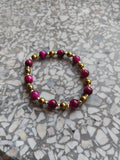 A genuine crystal bracelet pink-dyed tiger's eye and hematite golden minerals sizes your lucky charm