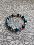 A genuine crystal bracelet blue-dyed tiger's eye and hematite silver minerals sizes your lucky charm