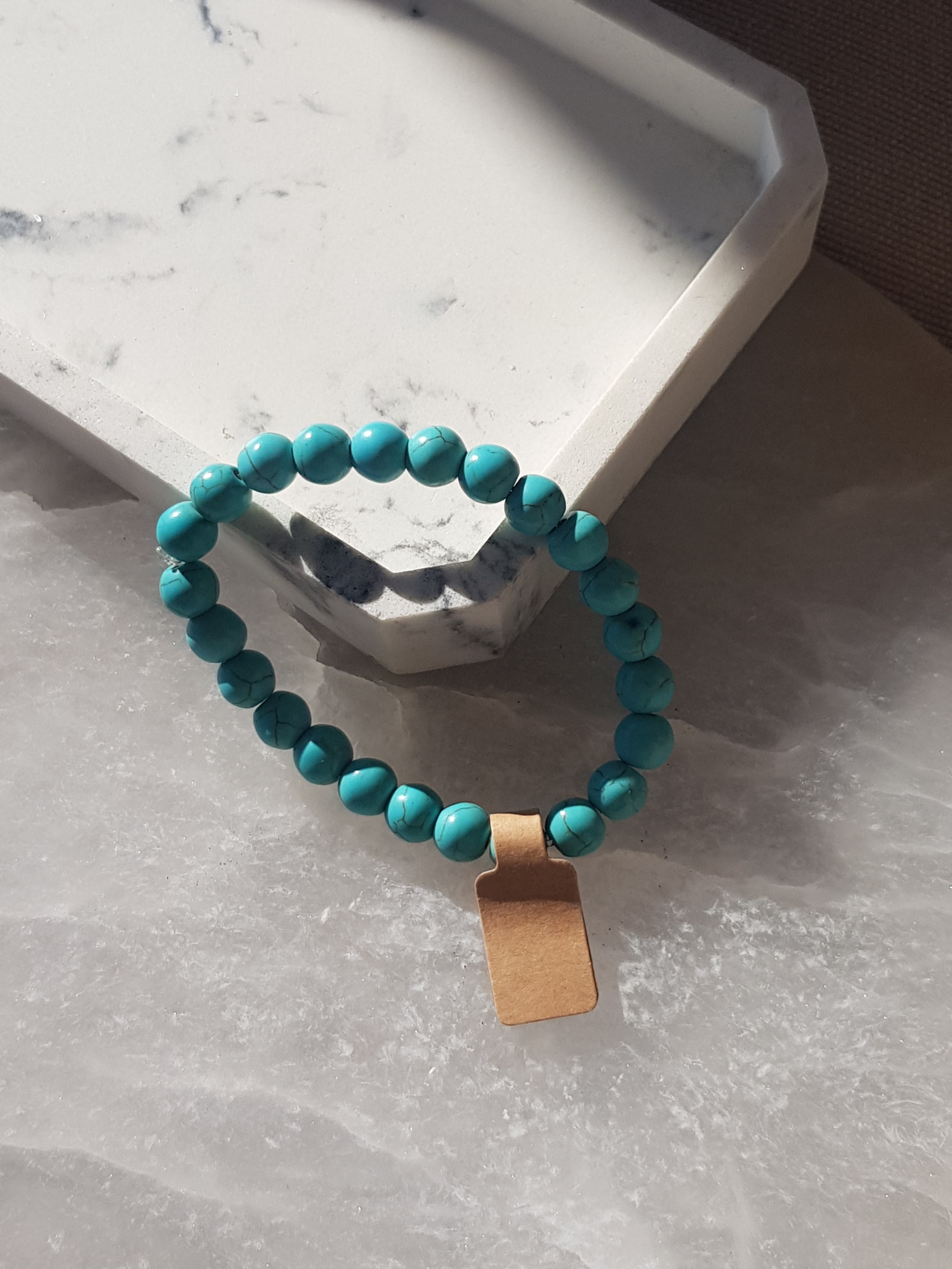 A turquoise blue-dyed genuine Howlite beaded crystal bracelet with spacers minerals 8 mm beads